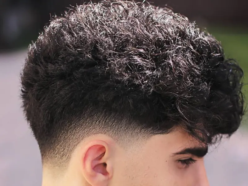 curly low drop fade for men