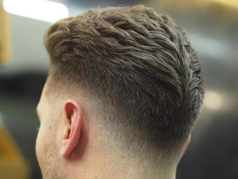 drop fade with middle part for men