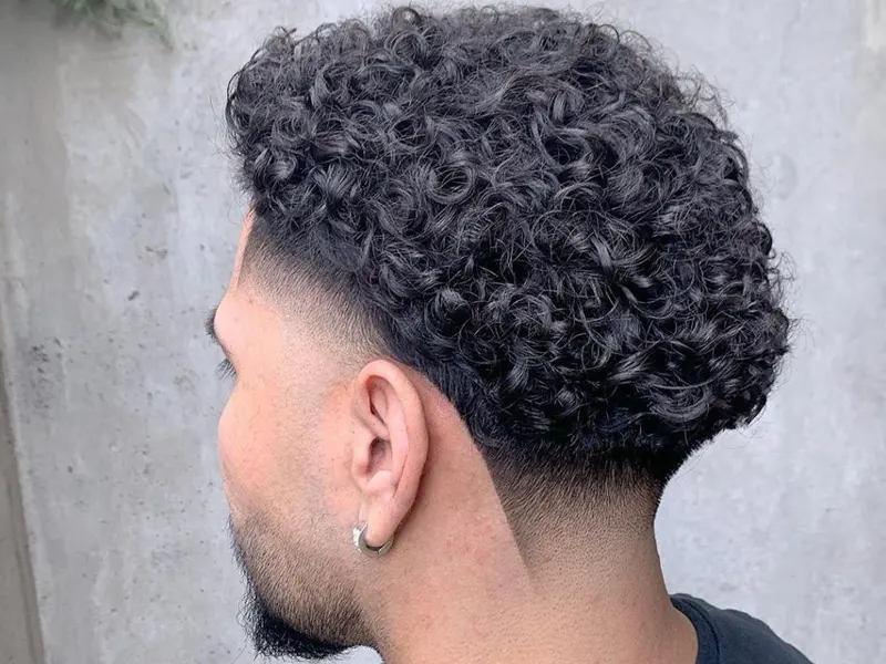 low taper fade on curly hair for men